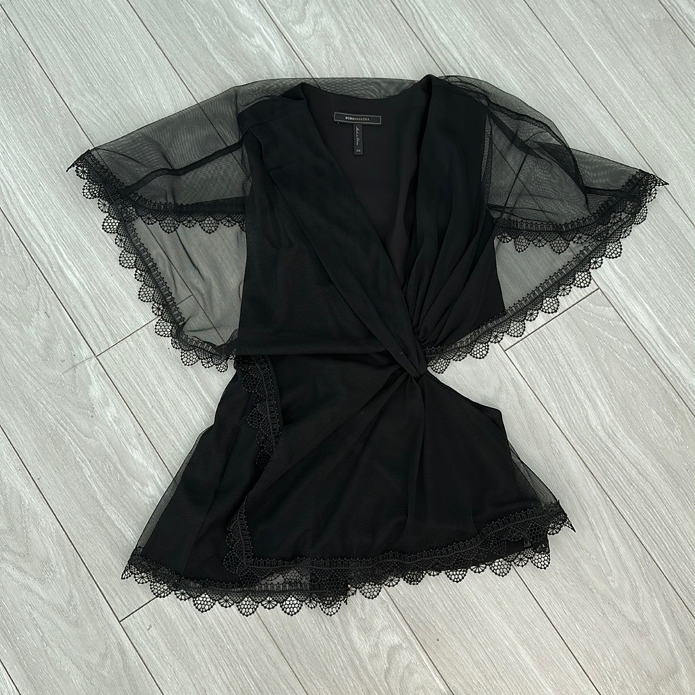 Beautiful lace and chiffon cutout top. BCBG size 4